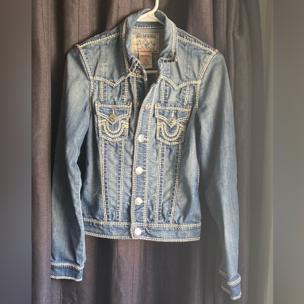 True Religion jean jacket. Classic white stitching. Distressed, blue size small